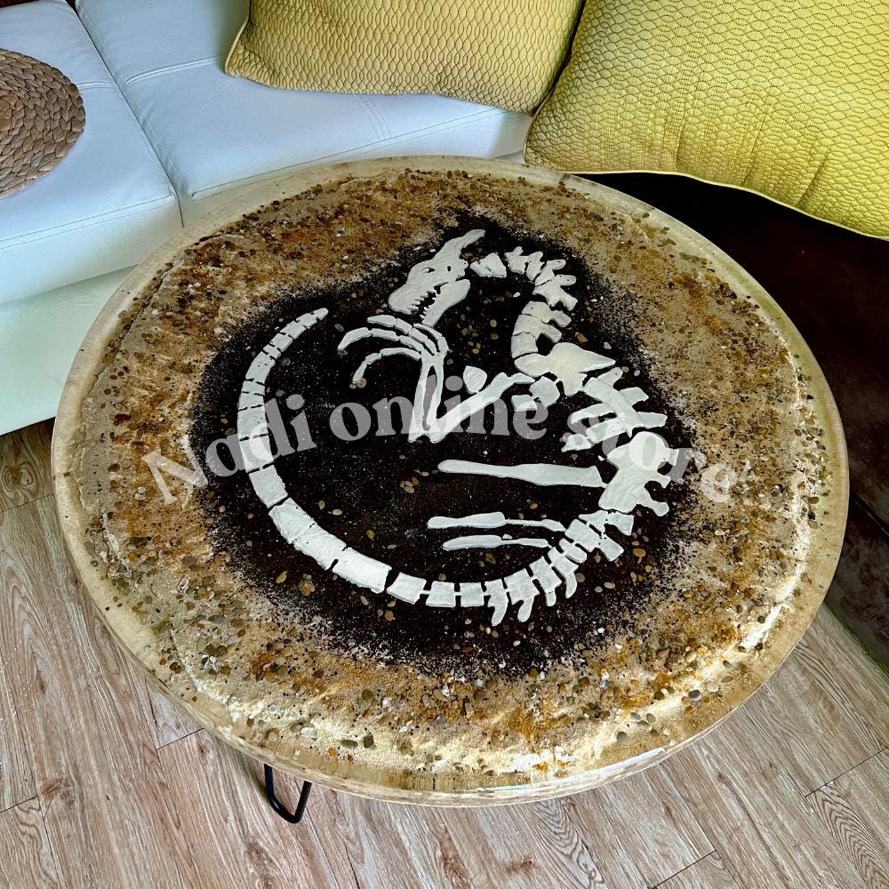 Dinosaur themed epoxy resin clear coffee table, ultra realistic fossil bedside nightstand, end table with metal legs, live edge pebble sand